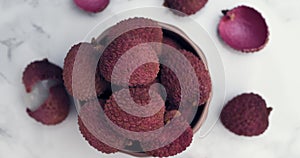 Lychee tropical fruit in glass bowl on table