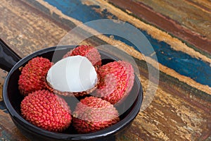 Lychee on a wooden table photo