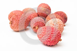 Lychees on white background