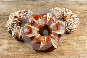 Lye kringle with sesame on a wooden board