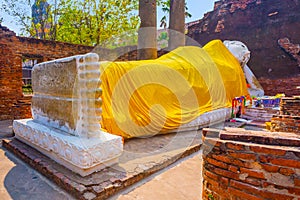 Lying Buddha dressed in yellow scarf in temple Wat Yai Chai mongkol