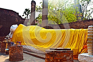 Lying Buddha dressed in yellow scarf in temple Wat Yai Chai-mongkol
