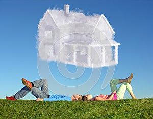 Lying couple on grass and dream house collage