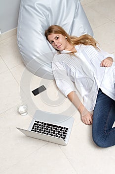 Lying on floor with a laptop