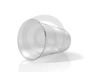 Lying horizontally transparent plastic cup.