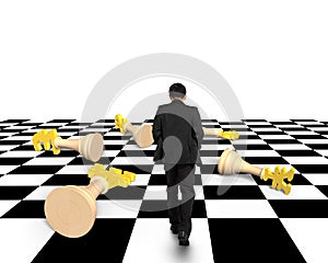 Lying money chess with businessman walking