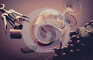 Lying vineglass with red grapevine