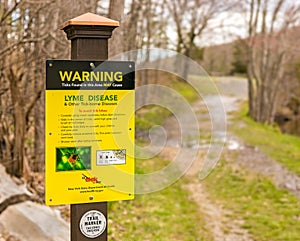 Lyme disease and tick warning sign trailside