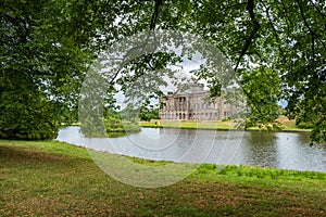 Lyme Hall and its pond inside Lyme Park in Cheshire, England.