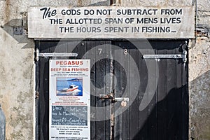 LYME REGIS, DORSET/UK - MARCH 22 : Quotation on a Garage Door at