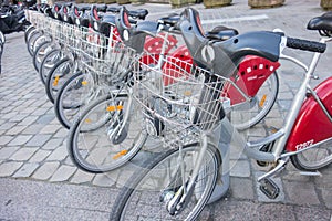 LYON, FRANCE - on APRIL 15, 2015 - Shared bikes are lined up in the streets of Lyons, France. Velo'v Grand Lyon has over 340