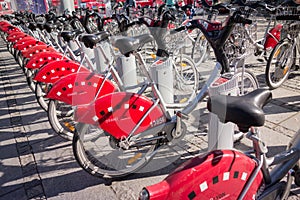 LYON, FRANCE - on APRIL 15, 2015 - Shared bikes are lined up in the streets of Lyons, France. Velo`v Grand Lyon has over 340 stati