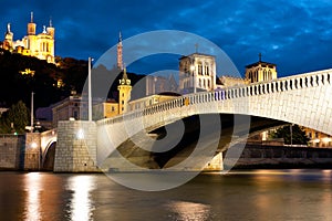 Lyon over the Saone river at cloudy night photo