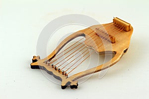 Lyre isolated against light background