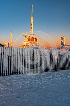 Lysa hora hill summit in Moravskoslezske Beskydy mountains during winter sunsest with clear sky