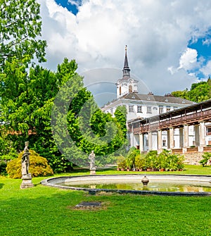 Lysice castle, Czech Republic. Famous baroque castle built in 14th century. Beautiful formal garden, palm trees and flowers.