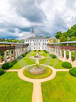 Lysice castle, Czech Republic. Famous baroque castle built in 14th century. Beautiful formal garden, palm trees and flowers.