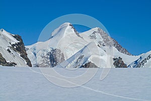Lyskamm summits on Monterosa traverse knife edge snow ridge glacier walk and climb in the Alps