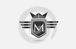 M alphabet letter logo icon for company in black and white. Creative badge design with king crown wings and shield for business