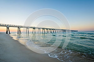 The M.B. Miller County Pier and Gulf of Mexico at sunrise, in Panama City Beach, Florida