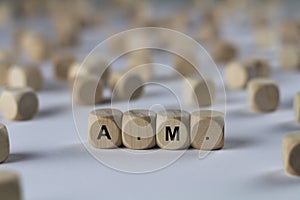 A.m. - cube with letters, sign with wooden cubes