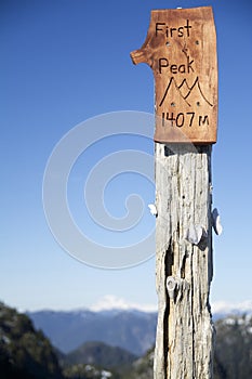 1407m First Peak Sign with Blue Sky on Mtn Seymour North Vancouver, BC photo