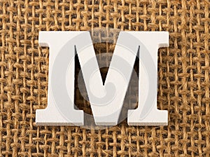 M, Letter of the alphabet - Burlap Background Texture