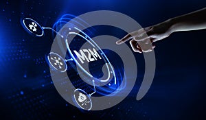 M2M Machine-to-machine technology concept. Hand Pressing button on virtual screen.