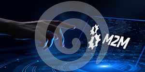 M2M Machine-to-machine technology concept. Hand Pressing button on virtual screen.