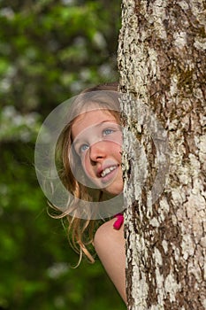 M portrait behind tree 4