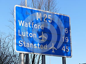M25 motorway sign at Chorleywood, Hertfordshire showing distances to Watford, Luton Airport and Stanstead Airport