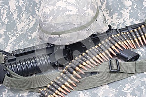 M4 carbine, kevlar helm and us army camouflage uniform