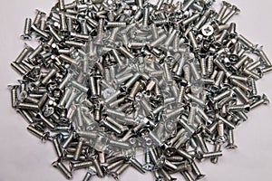 M6 metal screws galvanized white in bulk closeup