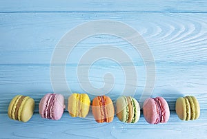 MaÑaroon on blue wooden sweet, french cake