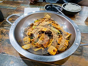 Ma la xiang pan, or Ma la xiang guo, Chinese food dish containing meat and vegetables. Spicy numbing stir-fry pot. photo