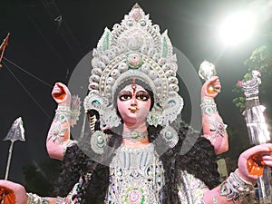 Maa Jagadhatri  thakur ,another form of Ma Kali , with  third eye on her forhead ,  with a big decorated kan pasha or ear ring.