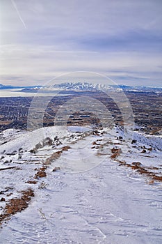 Maack Hill Sensei hiking trail views in snowy mountains, Lone Peak Wilderness Wasatch Rocky Mountains, Utah.