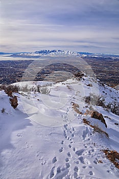 Maack Hill Sensei hiking trail views in snowy mountains, Lone Peak Wilderness Wasatch Rocky Mountains, Utah.
