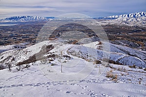 Maack Hill Sensei hiking trail views in snowy mountains, Lone Peak Wilderness Wasatch Rocky Mountains, Utah.