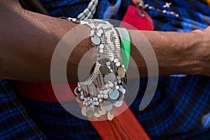 Maasai African manâ€™s wrist with beautiful handmade silver bangles in Arusha, Tanzania, Africa