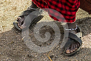 Maasai man wearing sandals with soles made of tire strips, in Arusha, East Africa