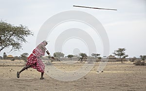 Maasai men practicing throwing a spear