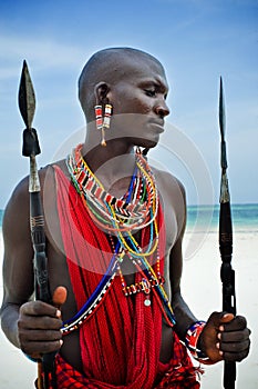 Maasai sitting by the ocean