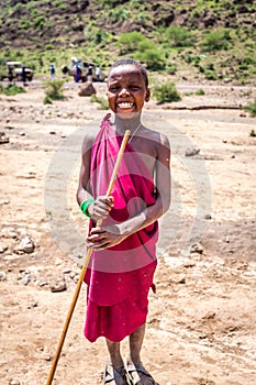 Maasai unidentified children in traditional dress smile with happiness