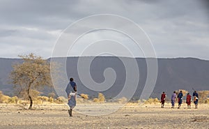 Maasai warriors in a savannah