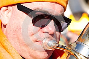 A wind band musician playing during the Carnival parade through the village of Amby (Maastricht)