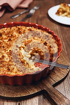 Mac and cheese. American Cheese pasta casserole with cheese sauce and crispy breadcrumbs