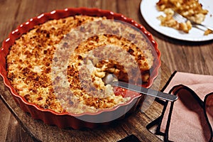 Mac and cheese. American Cheese pasta casserole with cheese sauce and crispy breadcrumbs