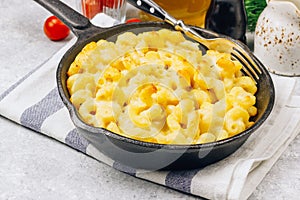 Mac and cheese, american style macaroni pasta with cheesy sauce