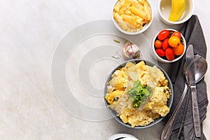 Mac and cheese on top of served table.